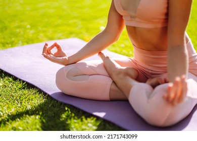 Young Woman Doing Excercise At The Public Park. Fitness Woman Doing Yoga Exercises In The Morning. Sport, Active Life.