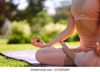 Young Woman Doing Excercise At The Public Park. Fitness Woman Doing Yoga Exercises In The Morning. Sport, Active Life.