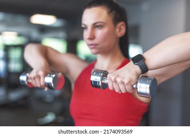 Young Woman Doing Exercise With Dumbbells Portrait, Depth Of Field