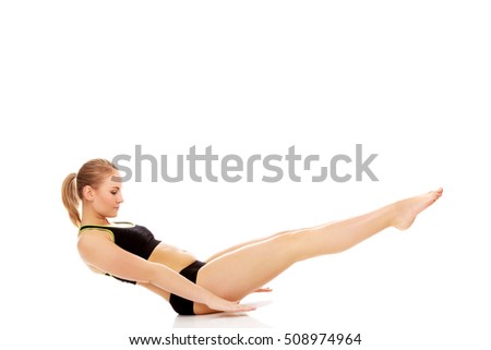 Young woman doing exercise on the floor