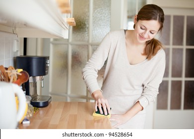 Young Woman Doing Housework, Cleaning The Kitchen