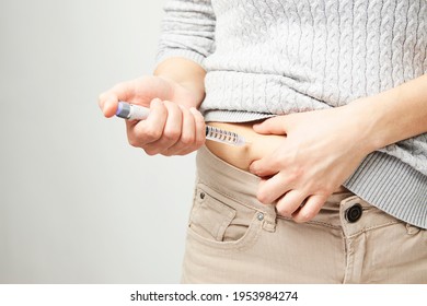 Young Woman Doing Insulin Injection Pen, Close-up. Diabetic Patient With Insulin Pen For Control Diabetes.