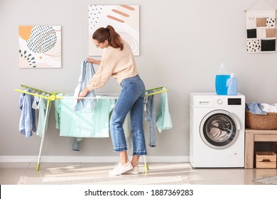 Young Woman Doing Laundry At Home