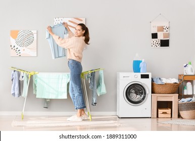 Young Woman Doing Laundry At Home