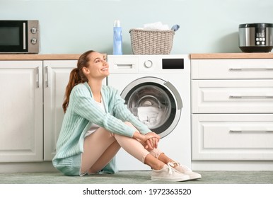 Young Woman Doing Laundry At Home