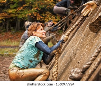 Young Woman Doing a Mud Race Challenge - Powered by Shutterstock