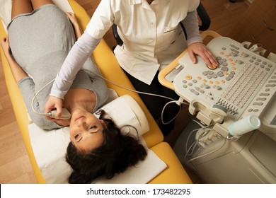 Young Woman Doing Neck Ultrasound Examination At Hospital