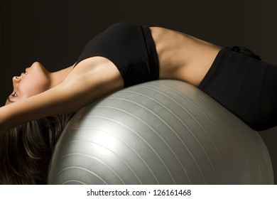 Young woman doing pilates - Powered by Shutterstock