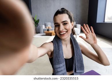 Young woman doing self portrait on yoga mat. Home vacation indoors portrait.Alone in interior. Happy emotion. Smiling female person. Lifestyle action. Posing influencer - Powered by Shutterstock