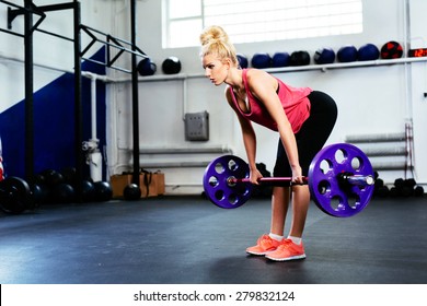 Young Woman Doing Straight Leg Deadlift Exercise