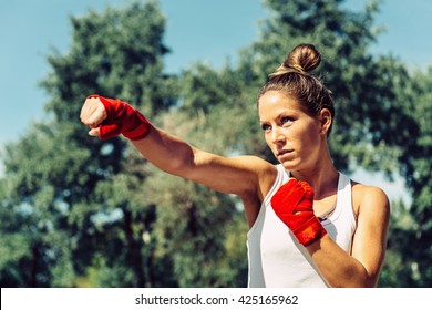 Young Woman Doing Taebo Direct Punch, Focus On Eyes