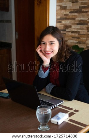 Similar – Image, Stock Photo Smiling businesswoman working at desk with laptop