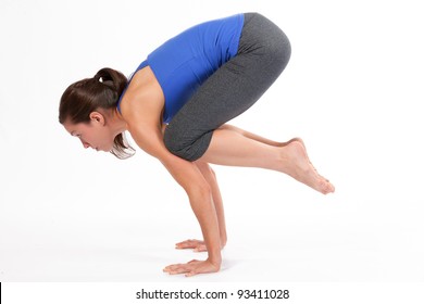 Young Woman Doing Yoga Crow Pose