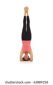 Young Woman Doing Yoga Headstand Pose