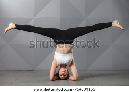 Young Woman Doing Yoga Meditation and Stretching Exercises