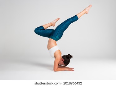 young woman doing yoga pose - Powered by Shutterstock