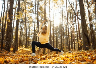 Young Woman doing yoga pose in peaceful natural forest. Lifestyle and Meditation concept. - Powered by Shutterstock