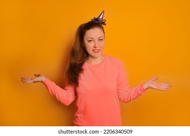 Young Woman Doubting And Shrugging Shoulders With Smile On Face On A Yellow Background.

Pretty Woman Having Doubts, Know Nothing, Cant Decide, Have No Clue And Looking At Camera In Pink Pullover.