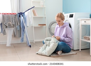 Young Woman With Down Jacket In Bathroom