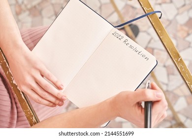 Young woman drawing goals indoors  Psychology treatment  Home vacation flatlay  Alone in interior  Happy emotion  Female person hands  Lifestyle action  Posing table
