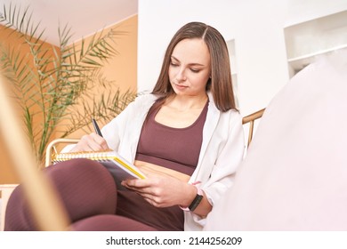 Young woman drawing neurographics indoors  Psychology treatment  Home vacation portrait  Alone in interior  Happy emotion  female person  Lifestyle action  Posing chair