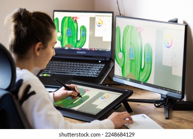 Young woman drawing on a digital tablet at home. Girl working from home as graphic designer. - Shutterstock ID 2248684129