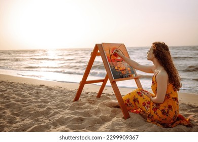 Young woman drawing the picture at the beach. Hobby and leisure concept. Talent and creativity. Canvas Painting. - Shutterstock ID 2299909367