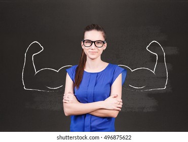 Young woman with drawn powerful hands - Shutterstock ID 496875622