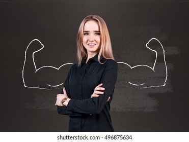 Young woman with drawn powerful hands - Shutterstock ID 496875634