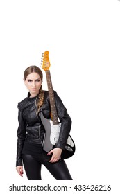 Young Woman Dressed In Black Leather Clothes Holds Electric Guitar