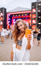 Young Woman Drinking Beer And Having Fun At Music Festival.  Beach Party, Summer Holiday, Vacation Concept.