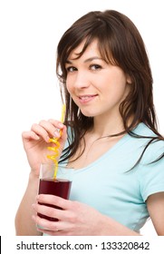 Young Woman Is Drinking Cherry Juice Using Straw, Isolated Over White