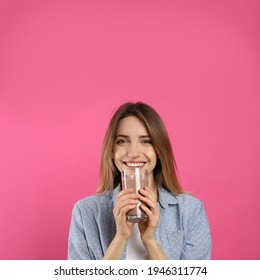 Young Woman Drinking Chocolate Milk On Pink Background