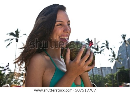 Young woman drinking coconut drink