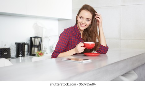 Young Woman Drinking Coffee At Home In The Morning