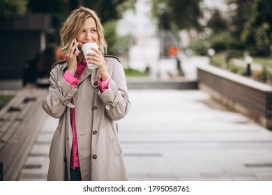 Young woman drinking coffee out in the city