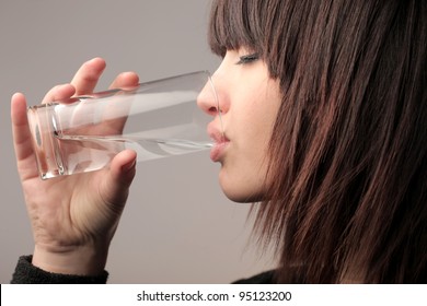 Young Woman Drinking A Glass Of Water