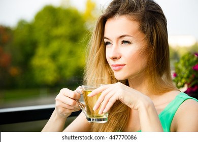 Young Woman Drinking Green Tea Outdoors