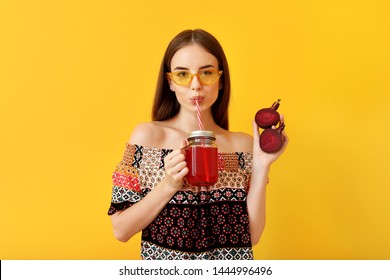 Young Woman Drinking Healthy Beet Juice On Color Background