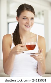 Young Woman Drinking Herbal Tea