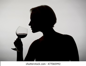 Young Woman Drinking Red Wine