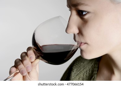 Young Woman Drinking Red Wine