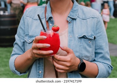 Young Woman Drinking Strawberry Daiquiri Cocktail Or Mocktail In Glass With Drinking Straw At Summer Festive. Refreshing Summer Drink For Party Or Festive