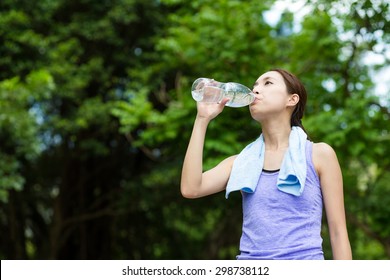 Young Woman Drinking Water After Running Stock Photo 298738112 ...