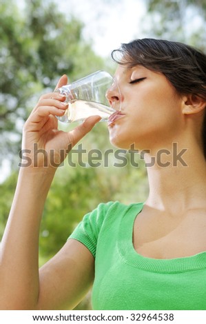 young woman drinking with waterglass