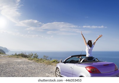 Young woman drive a car on the beach. - Shutterstock ID 446353453
