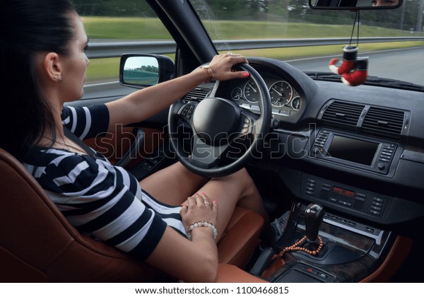 Young woman drive a suv\
car very fast