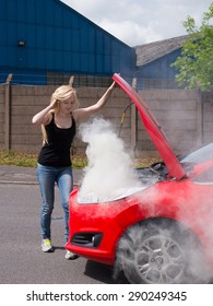 Young Woman Driver With Car Fire Breakdown