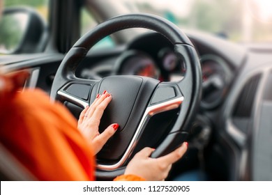 
Young Woman Driver Driving A Business Car.