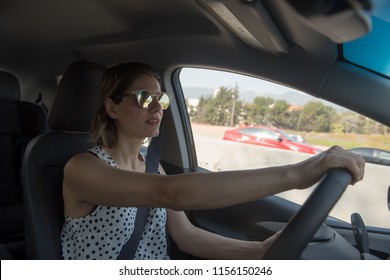 Young Woman Driving A Car 